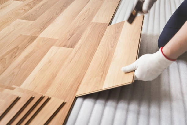 Installing wood-look vinyl planks over a foam underlayment with precision. -commercial flooring contractors